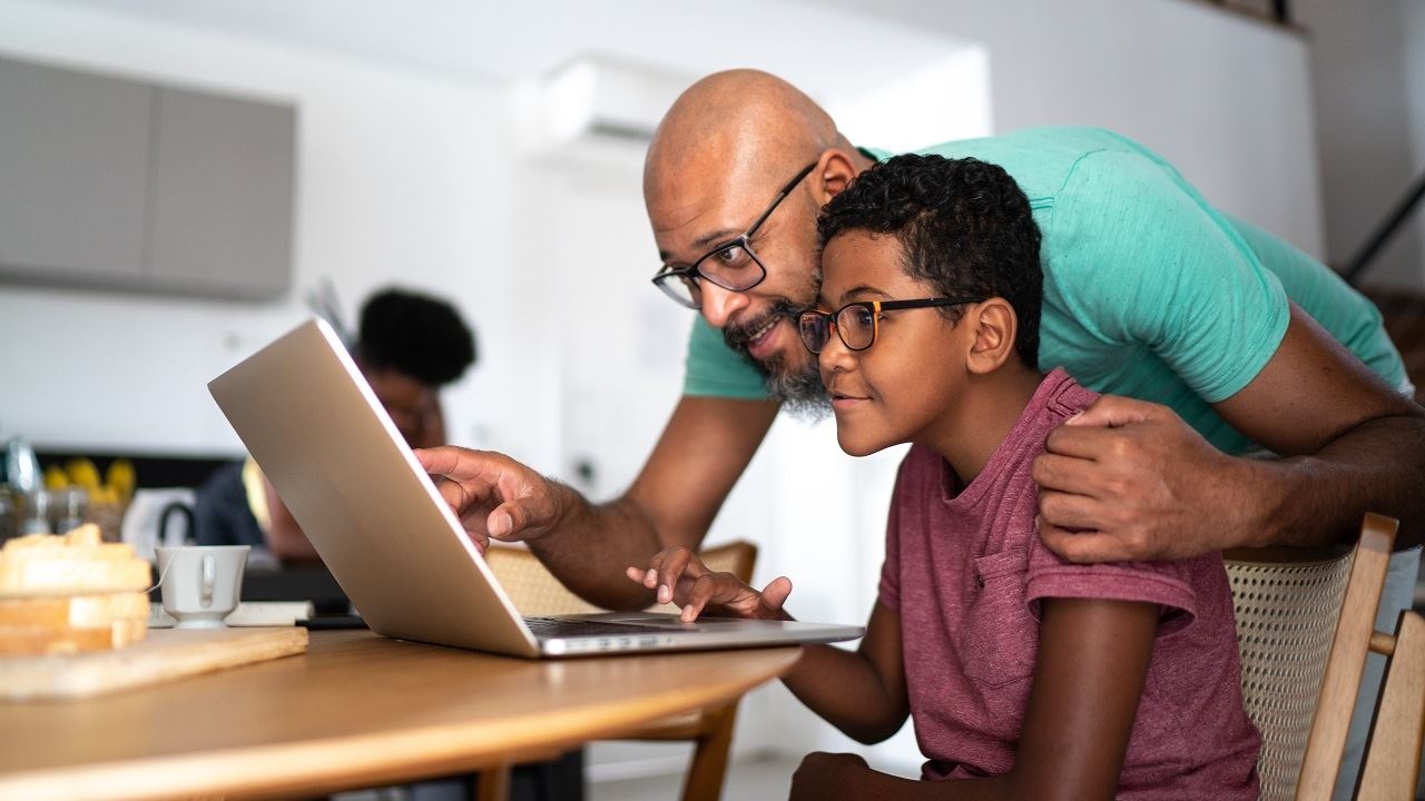  Father and Son working on laptop